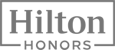 The image shows the Hilton Honors logo, featuring the word "Hilton" above "HONORS" inside a rectangular border.