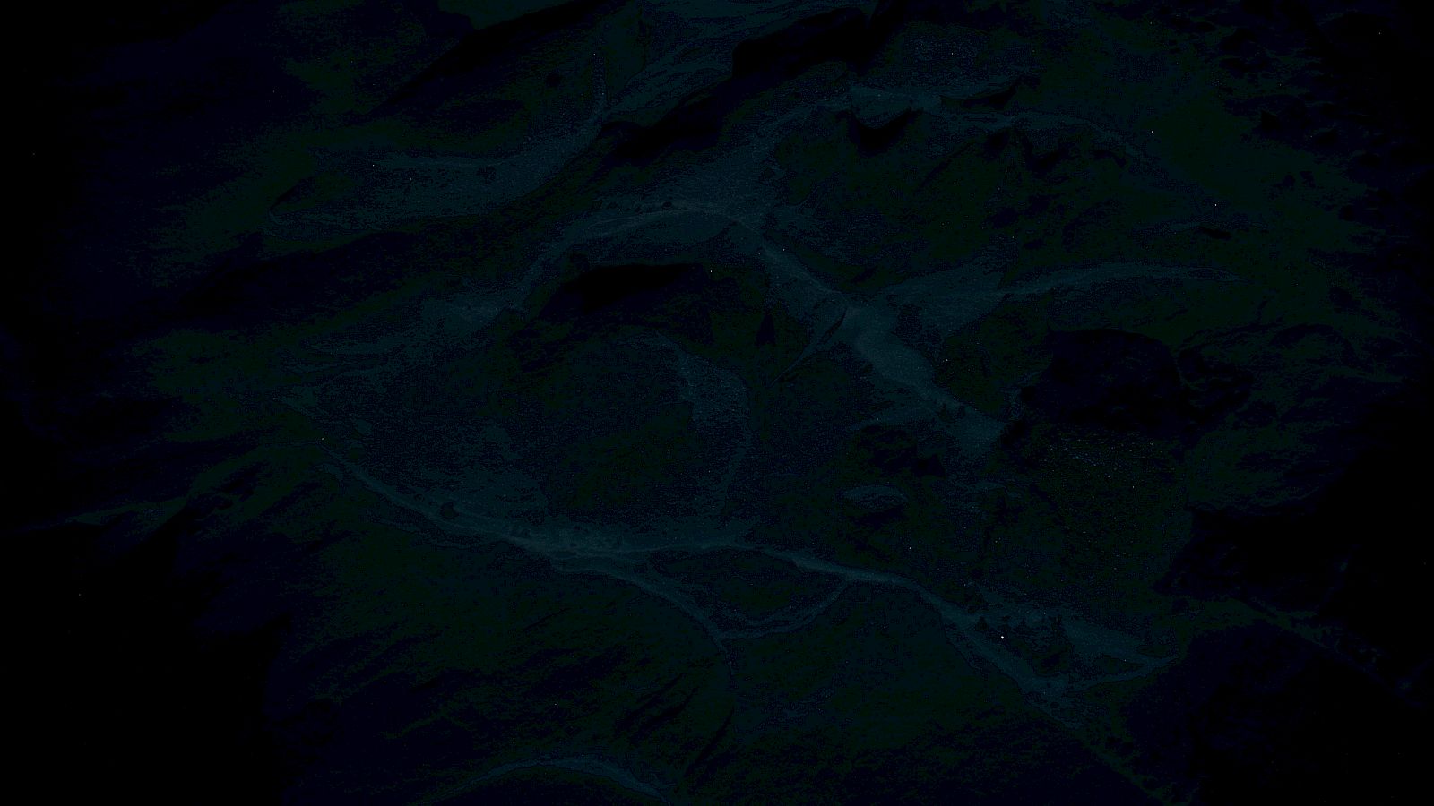 This image is very dark and unclear, making it difficult to identify any specific objects or scenery.